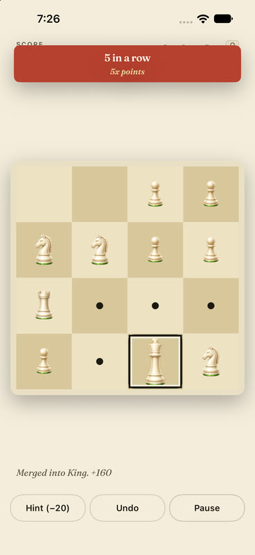 A Queen merge creates a King on iPhone during a five-merge combo